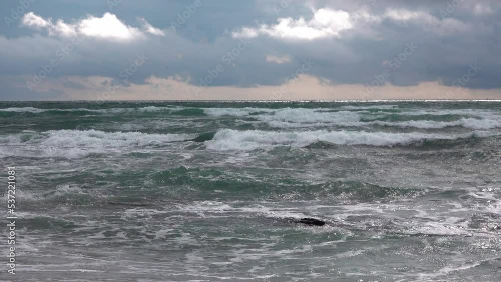 Ocean surface with waves to the horizon under dramatic sky Ocean surface with waves to the horizon under dramatic sky
