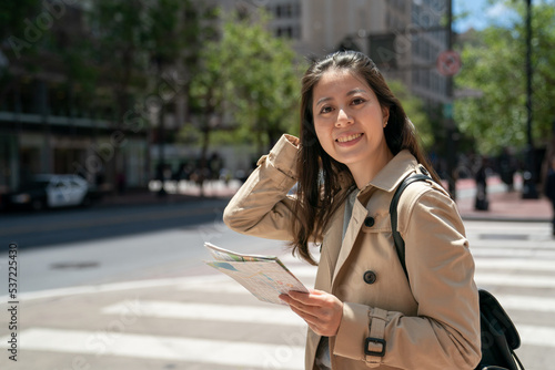 Photography portrait of happy asian Japanese female traveler looking at camera with smiling