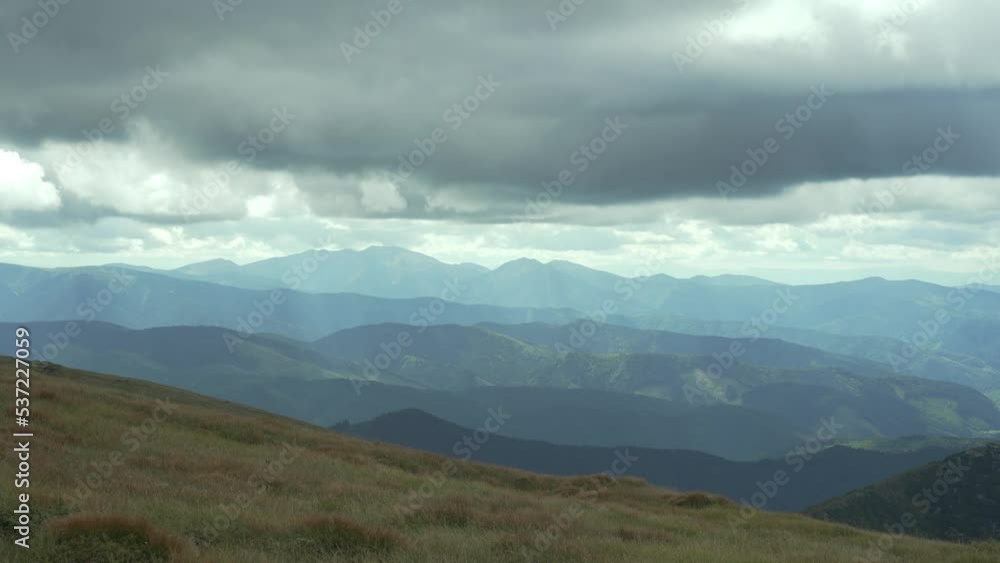 Mountain landscape, green mountains in cloudy weather. Mountains before the rain. Ukrainian Carpathian Mountains. A distant mountain range. Heavy clouds. Peace at the top. High quality 4k footage Mountain landscape, green mountains in cloudy weather. Mountains before the rain. Ukrainian Carpathian Mountains. A distant mountain range. Heavy clouds. Peace at the top. High quality 4k footage