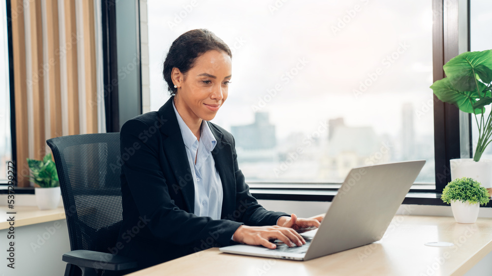 Successful asian businesswoman working and looking camera at her office desk, Concept of business risk analysis and assessment Successful asian businesswoman working and looking camera at her office desk, Concept of business risk analysis and assessment