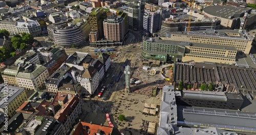 Oslo Norway v27 birds eye view flyover jernbanetorget plaza across historic sentrum district capturing downtown cityscape with traveller crowds in busy transit hub - Shot with Mavic 3 Cine - June 2022 photo