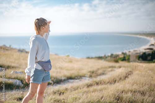 Traveller girl outdoor in park looking into the horizon