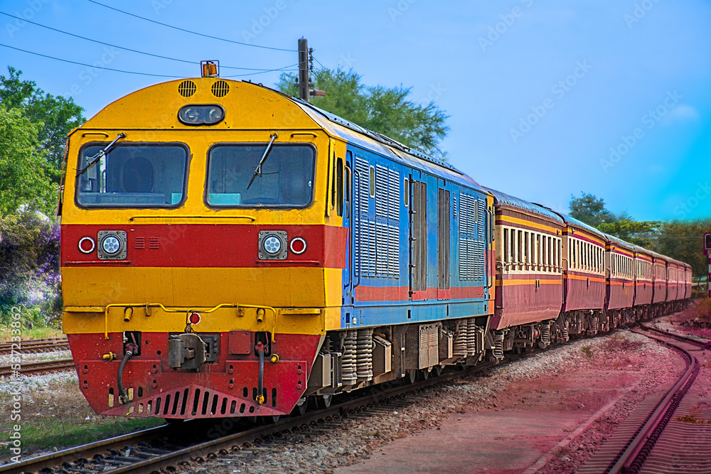 Passenger train by diesel locomotive at the railway station