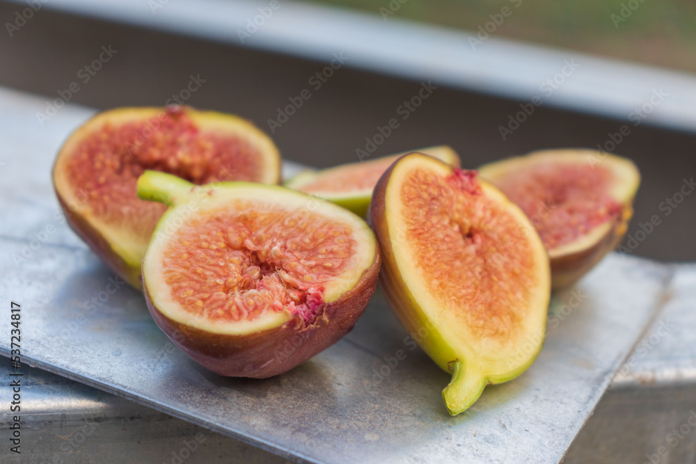 Ripe figs on a light background