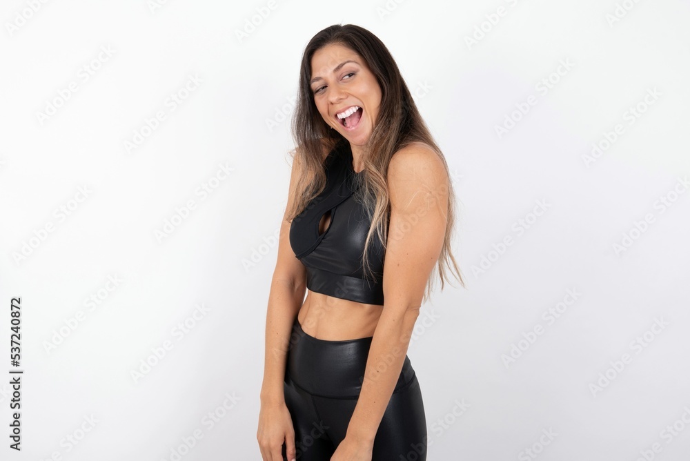young beautiful woman wearing sportswear over white background very happy and excited about new plans. young beautiful woman wearing sportswear over white background very happy and excited about new plans.