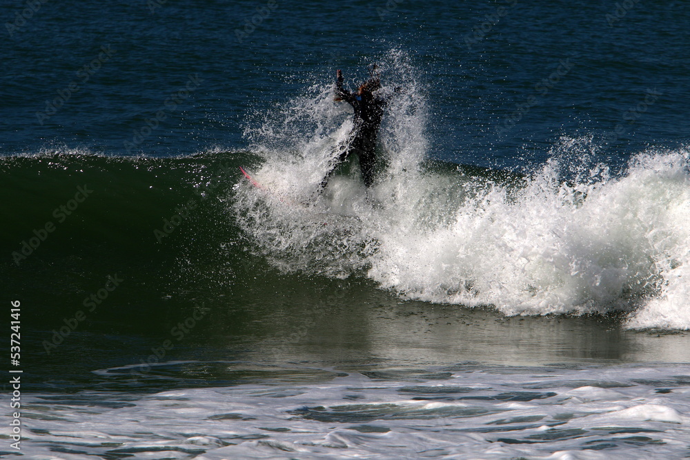 Surfing on high waves on the Mediterranean Sea in northern Israel. Surfing on high waves on the Mediterranean Sea in northern Israel.
