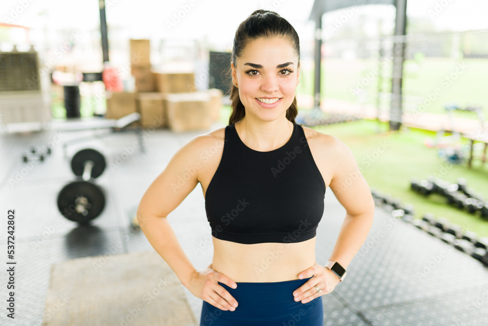 Happy sporty woman ready to start working out at the gym Happy sporty woman ready to start working out at the gym