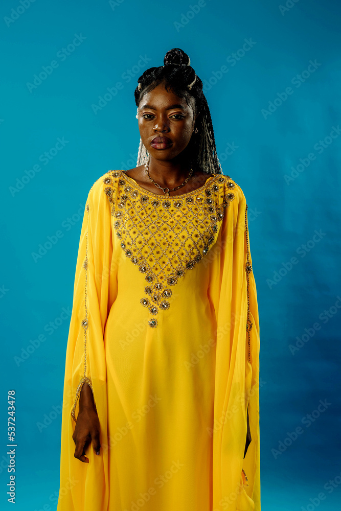 a girl in a yellow dress on a blue background a girl in a yellow dress on a blue background