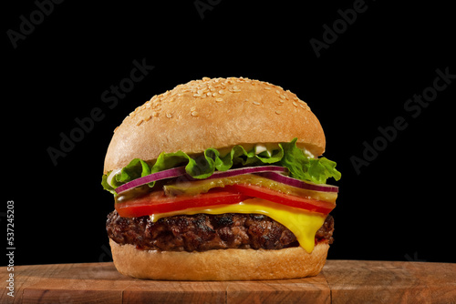 classic burger on wooden board
