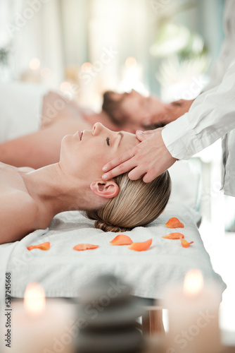 Spa, couple head massage and healthcare or skincare of a woman feeling relax and peace. Wellness, beauty and luxury facial body therapy and cosmetic dermatology or bodycare at a salon