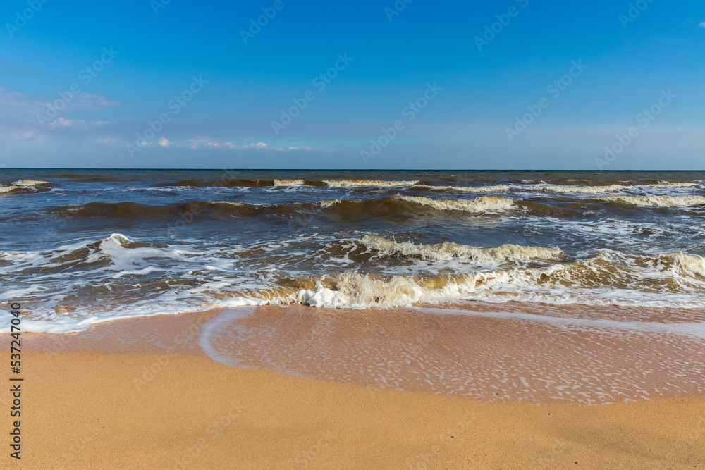 Fototapeta premium The Black Sea in sunny weather. Surf on the beach, waves,sandy shore