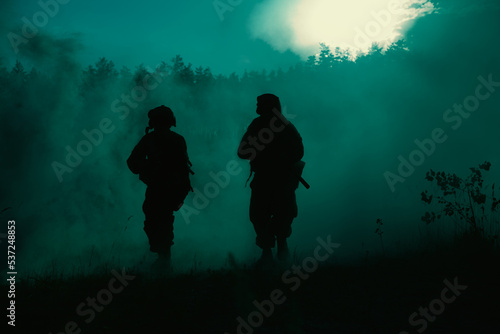 United States Marines in action. Military battle  forest battlefield  smoke grenades