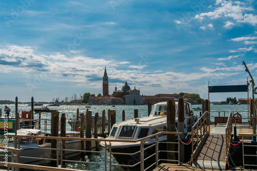Fotografie Water taxi rank on the Venice waterfront on the Grand Canal with a view of the i