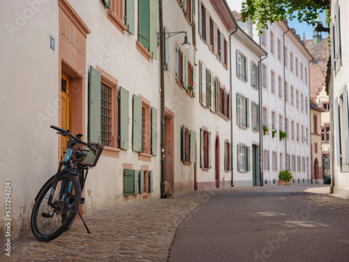 Buildings in the city centre of Basel   Switzerland. Colorful house with bike near entrance