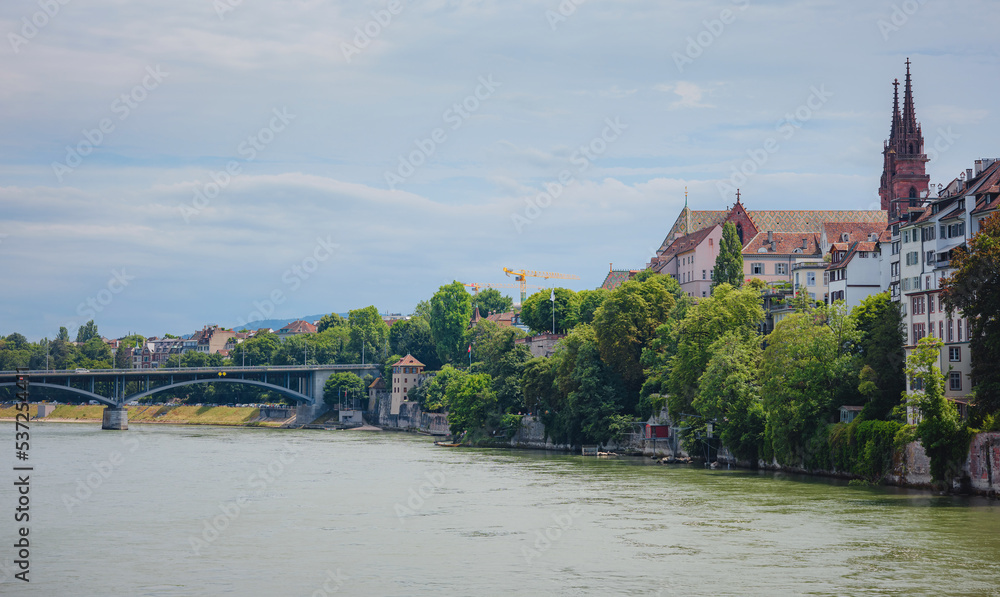 Fototapeta premium Buildings in the city centre of Basel and the Rhine river, Switzerland. Riverside of swiss city