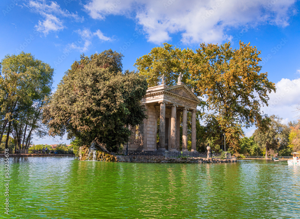 Temple of Asclepius situated in the middle of the small island on the artificial lake in Villa Borghese gardens , Rome, Italy. The greek inscription «Ασκληπιωι Σωτηρι» meaning 'Asclepius Savior'.