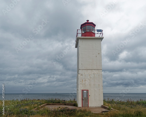 The light tower located on Caribou Island  Nova Scotia  Canada. A square concrete structure.