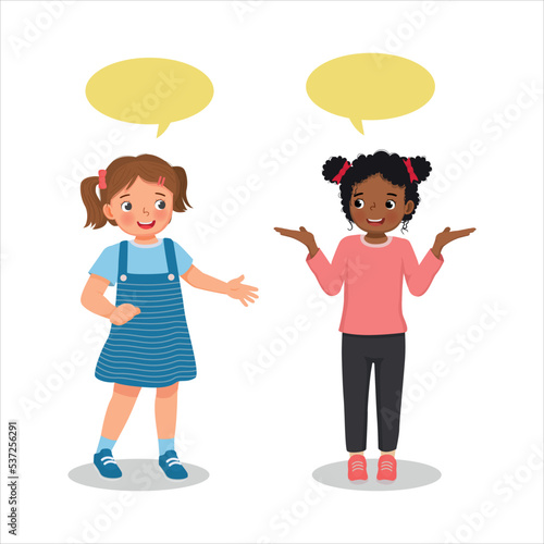 happy two cute kids little girls talking each other with speech bubble	
