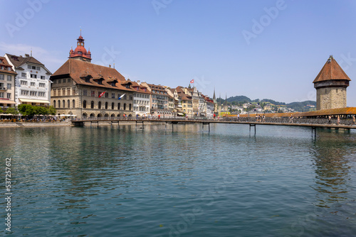 LUCERNE, SWITZERLAND, JUNE 21, 2022 - View of Rathaussteg bridge and the City Hall (Rathaus) in the center city of Lucerne, Switzerland
