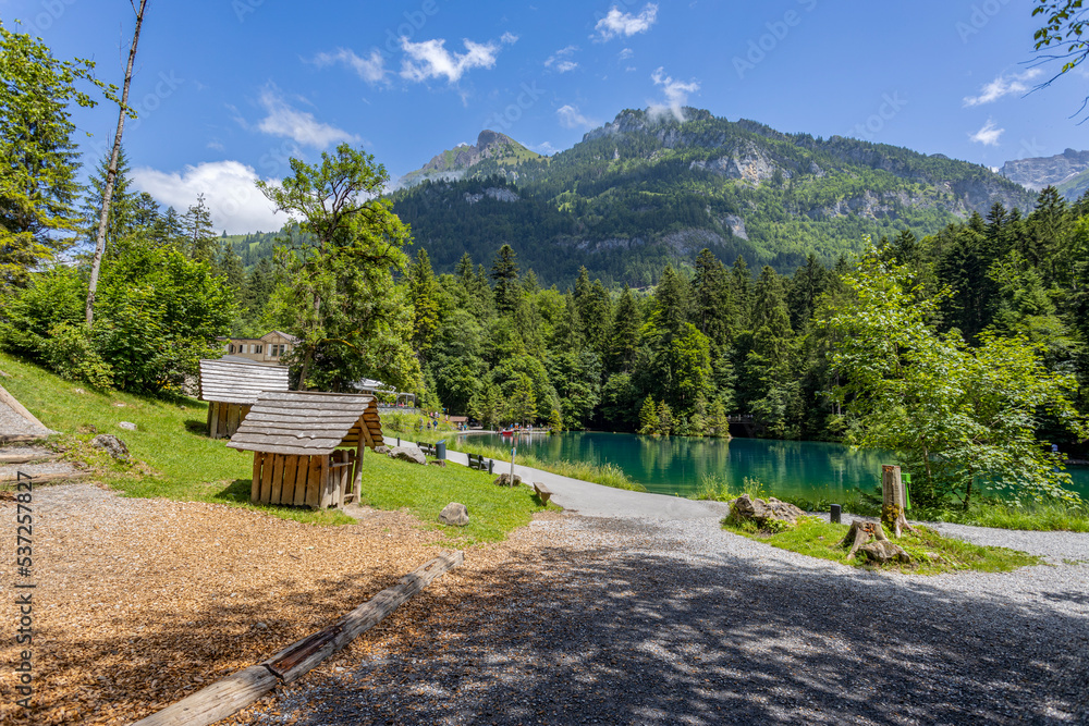 Obraz premium View of Blausee (The Blue lake) in Bernese Oberland, famous tourist destination in Switzerland