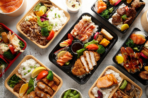 Bento Japanese food dishes on table