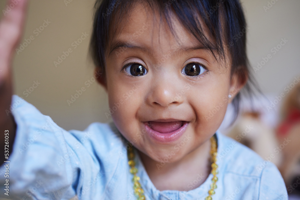 Children, down syndrome and selfie with a girl taking a photograph while looking cute or adorable. Kids, disability and picture with a young female child posing for a self portrait alone in her home Children, down syndrome and selfie with a girl taking a photograph while looking cute or adorable. Kids, disability and picture with a young female child posing for a self portrait alone in her home