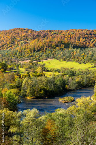The San River Valley. The village of Tworylne, Bieszczady Mountains, Poland. Colorful autumn mountain landscape.