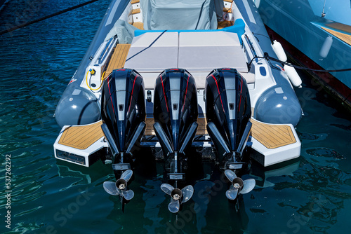 Three powerful outboard motors photo