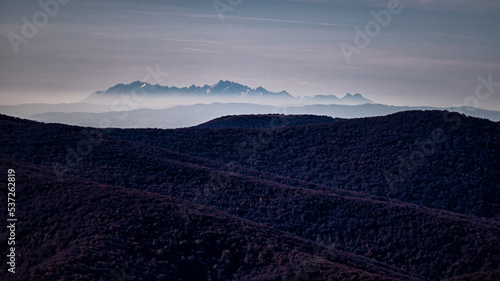 The Tatra Mountains seen from the Bieszczady Mountains. The temperature inversion and long distant visibility.