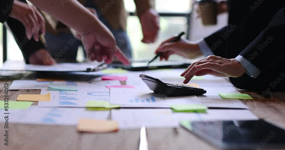 Team of Business people working at workplace with tablet and document, doing planning analyzing Tax financial report, business plan investment, finance analysis Economic business discussions. Team of Business people working at workplace with tablet and document, doing planning analyzing Tax financial report, business plan investment, finance analysis Economic business discussions.