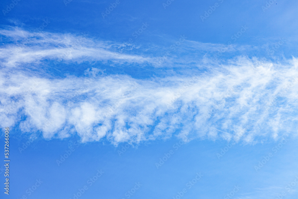 Blue sky and white clouds. In the middle of the blue sky are white clouds Blue sky and white clouds. In the middle of the blue sky are white clouds
