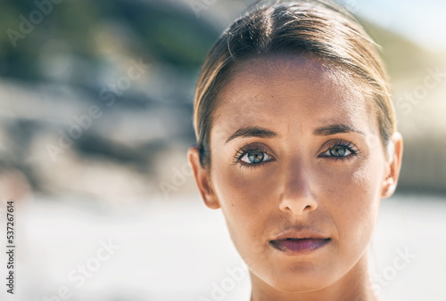 Portrait of woman with serious face at the beach  thinking and determined. Inspiration  motivation and vision of girl with thoughtful expression in nature. Mockup for wellness  mindful and freedom