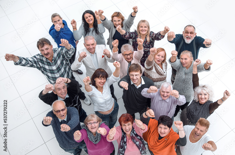group of confident mature people showing their success
