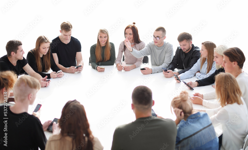 study group of young people sitting at a round table study group of young people sitting at a round table