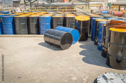 Industry oil barrels or chemical drums stacked up.chemical tank.container of barrels of hydrocarbons.hazardous waste of black and blue tank oil.