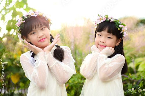 Two Asian sister in garden