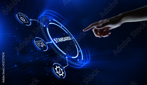 Standard standardization certification quality control assurance. Hand pressing button on virtual screen.