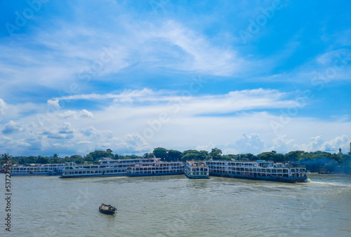 Beautiful landscape of Chandpur river port in Bangladesh. Ferry boats on the river with a cloudy sky background. Panoramic view. 