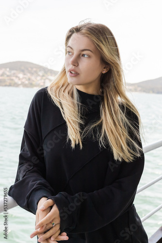 young woman looking at sea from ferry boat crossing bosphorus strait in istanbul. © LIGHTFIELD STUDIOS