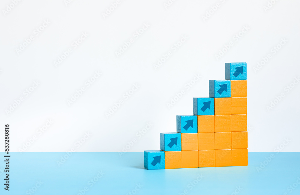 Fototapeta premium Business growth or step for success concepts with arrow graph, on wood box