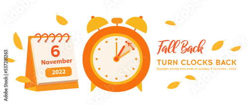 Fall Back Time for USA with calendar date 6 november, 2022. Daylight saving time ends reminder banner. Clock change back one hour. Orange alarm clock with autumn leaves decoration