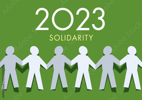 Une origami qui représente un groupe de personnes qui se donnent la main en signe de solidarité pour l’année 2023.
