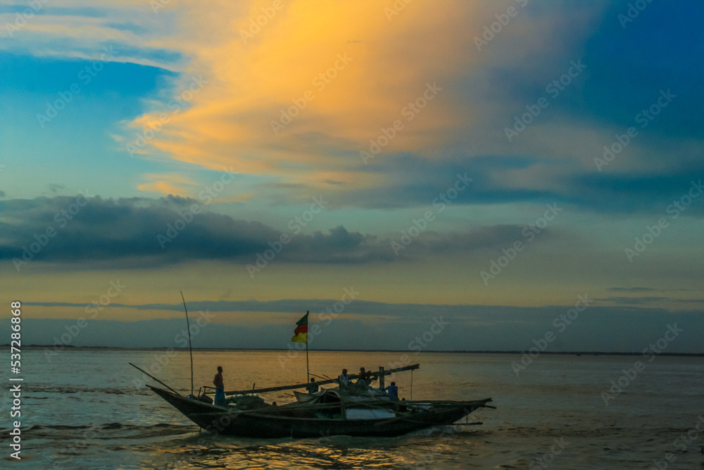 Traditional fishing boat on the river. Fisherman in a small boat on the river. Traditional fishing boat on the river. Fisherman in a small boat on the river.