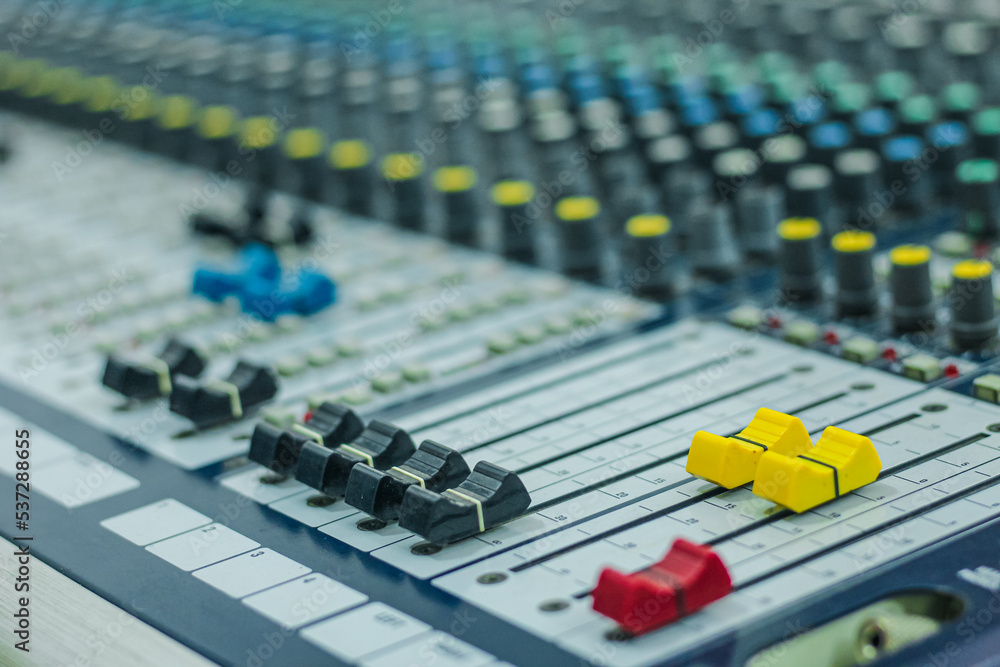 Sound check for the concert. Mixer control. Music engineer. Buttons and tabs in various parts of the audio controller. Selective focus. Sound check for the concert. Mixer control. Music engineer. Buttons and tabs in various parts of the audio controller. Selective focus.