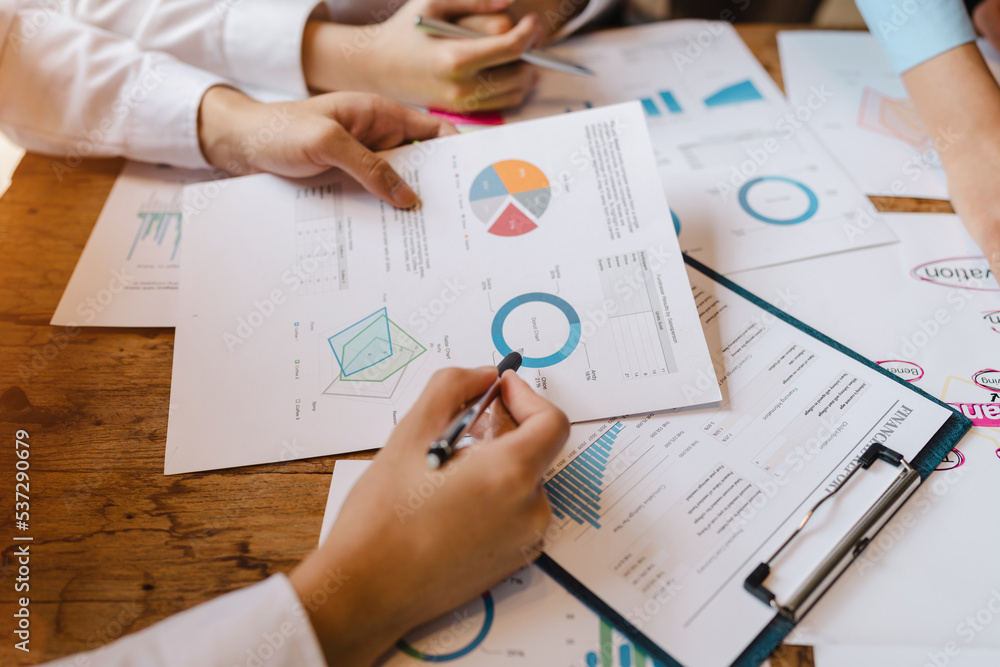 Group of asian business advisor discussing financial reporting situation together in boardroom. Group of asian business advisor discussing financial reporting situation together in boardroom.