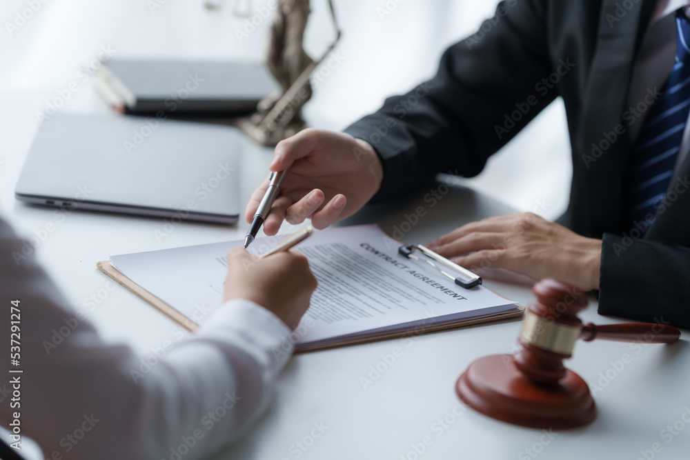 Business people negotiating a contract. discussing at desk of lawyer, legislation concept. Business people negotiating a contract. discussing at desk of lawyer, legislation concept.