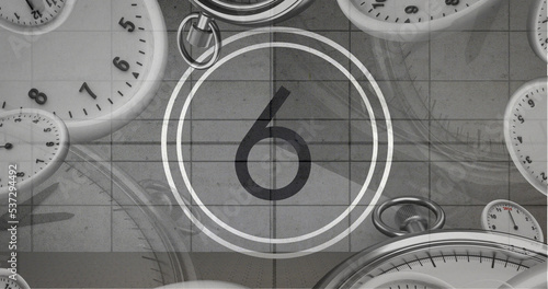 Image of number six in vintage black and white film projector countdown with clocks and watches
