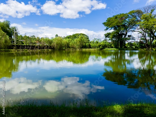 Scenery garden and lake river with tree for rest relax in Kanchanaburi , Thailand