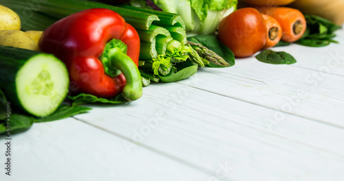 Close-up of various fresh raw vegetable on wooden table, copy space