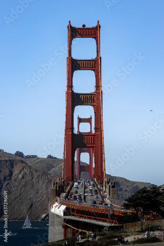Famous Golden Gate bridge in San Francisco with a clear blue sky and wavy sea